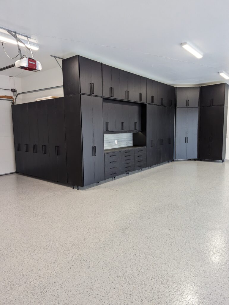 Black Garage cabinets, with epoxy flooring